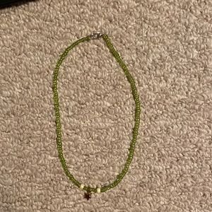 green necklace and a star charm